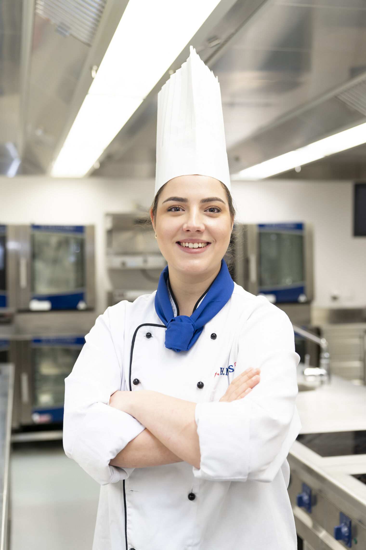 BHMS culinary academy student working in a famous restaurant's kitchen